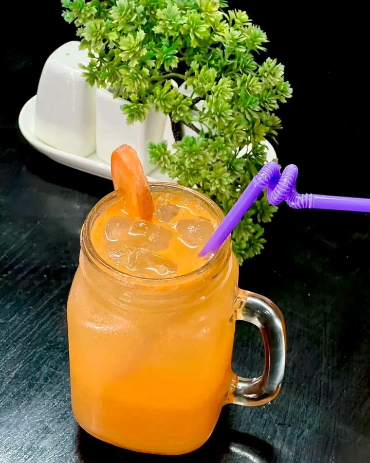 Cold orange drink in mason jar