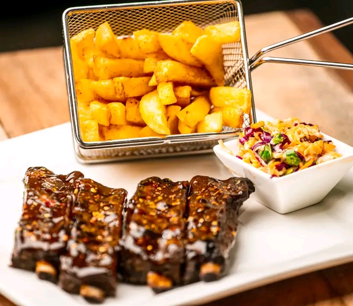 Glazed ribs with fries and coleslaw